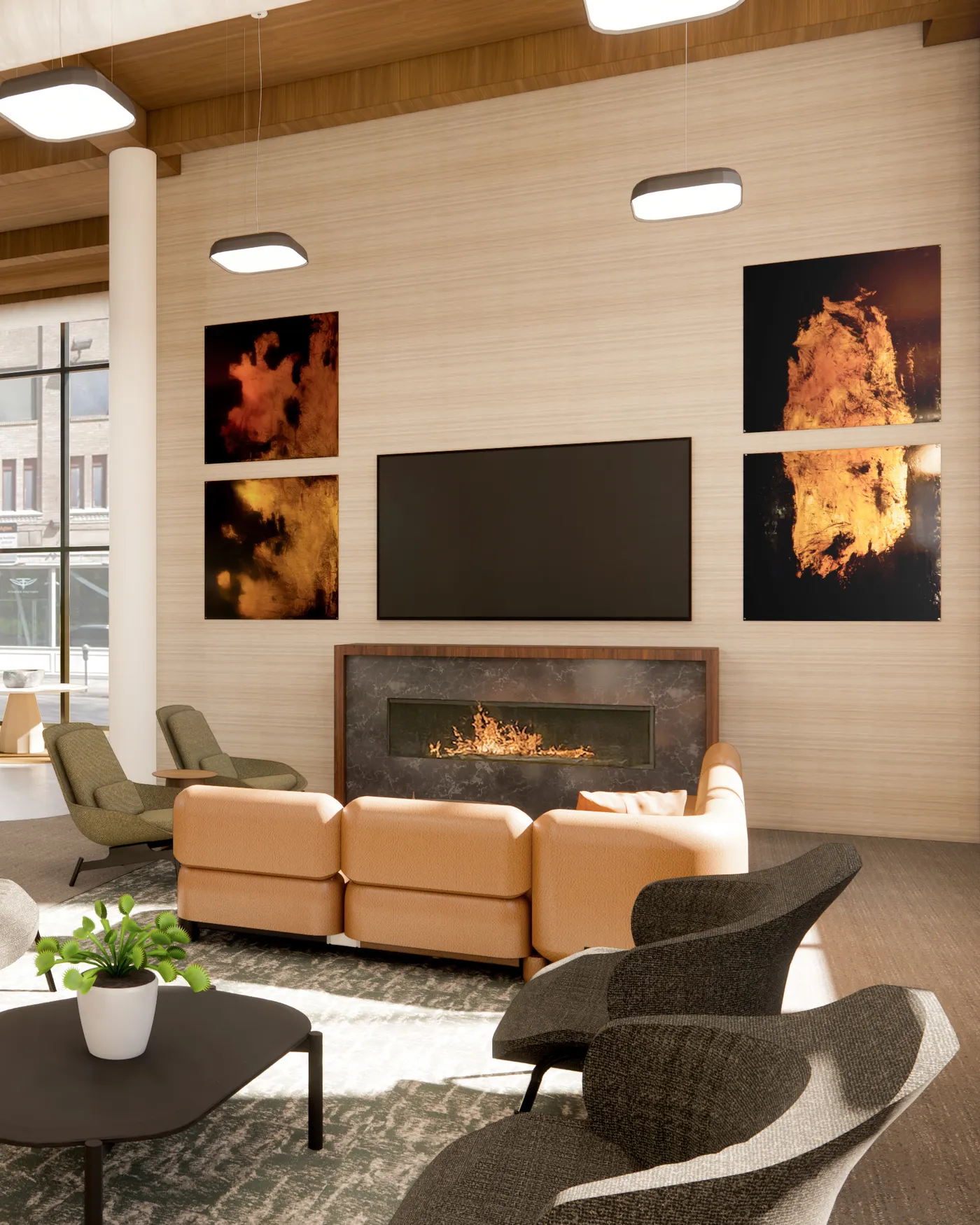 Leather sofa and lounge chairs gathered around the lounge fireplace, beneath tall ceilings and pendant lights